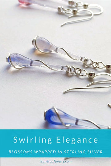 Swirling elegance - flower blossom inspired glass jewelry wrapped in spirals of silver
