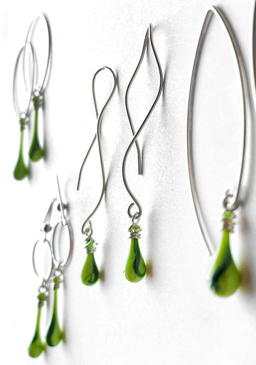 Striking lime green glass earrings with a streak of dark green with glitter!